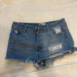 Ripped blue Jean shorts